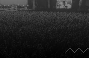 Black and white photo of the crowd for the ''about us'' section